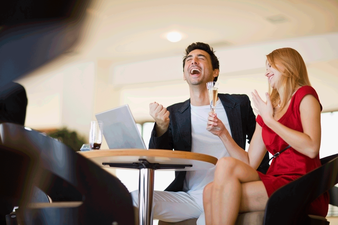 Couple celebrating after having their offer accepted in a hot housing market